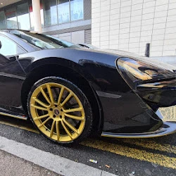 McLaren 570s black machine polished in London Canary Wharf